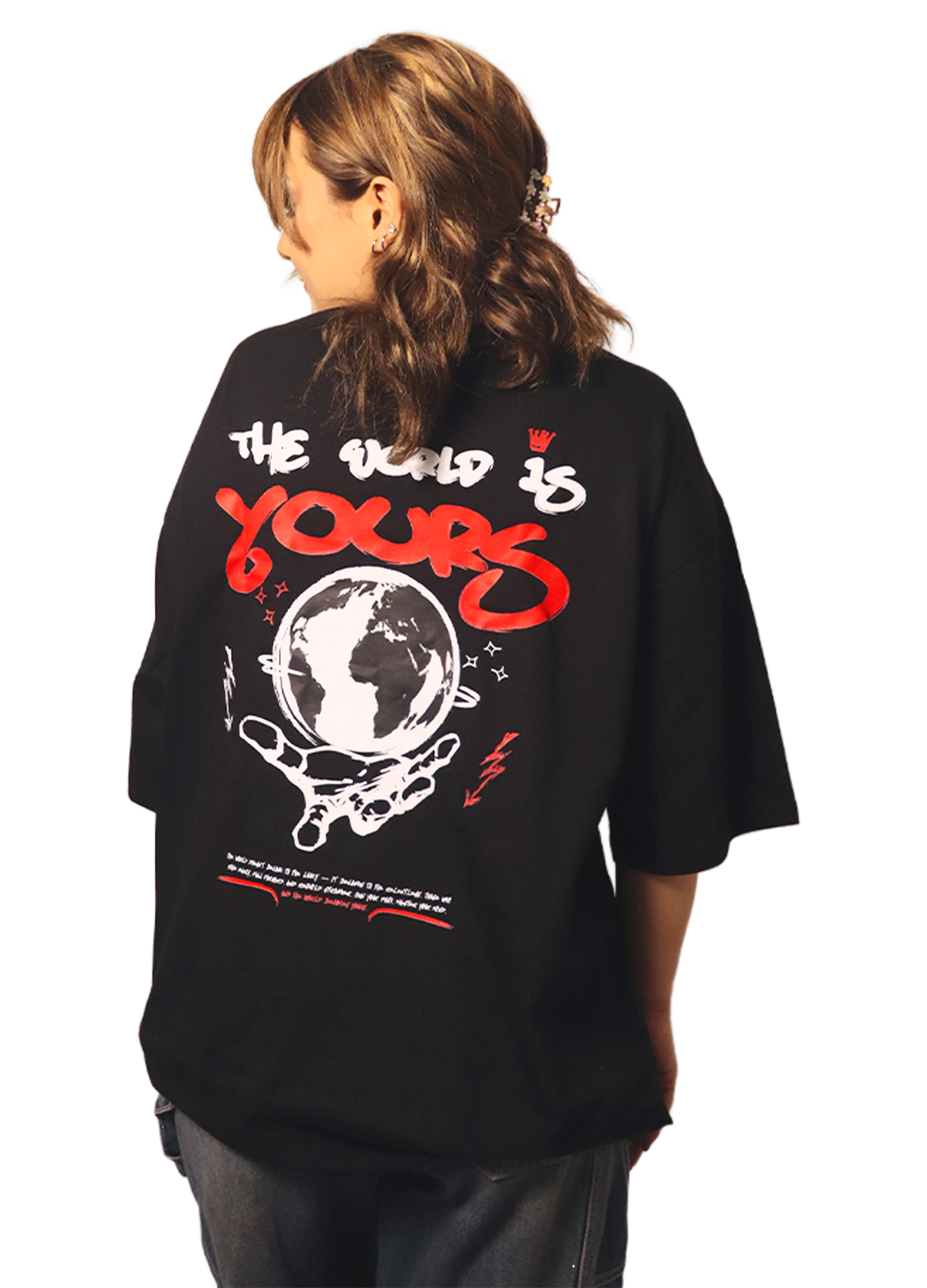 Black unisex oversize tee with red and white graphic print of a globe and text The world is yours